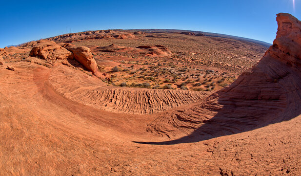 A wavy sandstone slope, a fossilized sand dune, at Ferry Swale in the Glen Canyon Recreation Area near Page, Arizona, United States of America
