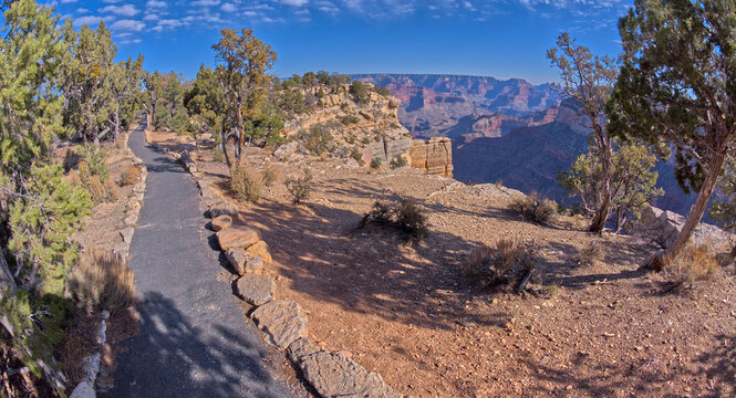 The paved rim trail along the cliffs of Grand Canyon South Rim between the Trailview Overlook East Vista and the West Vista, Grand Canyon, UNESCO World Heritage Site, Arizona, United States of America