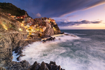 Magical light envelops the famous village of Manarola during an autumn sunset, Manarola, Cinque Terre National Park, UNESCO World Heritage Site, La Spezia, Liguria, Italy