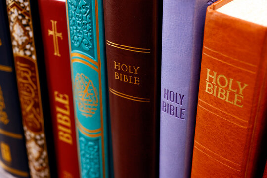 Bible, Quran and Torah, interfaith (interreligious) symbols of Christianity, Islam and Judaism, faith and spirituality concept, France