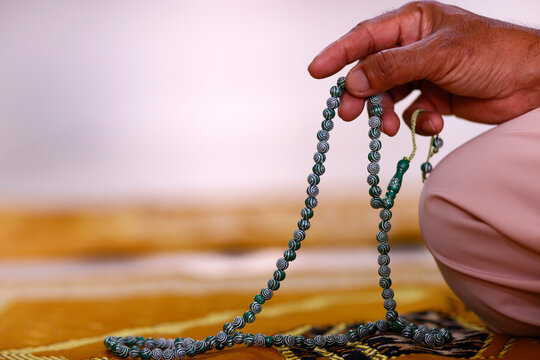 Close-up of hand of Muslim man praying with Islamic prayer beads, Chau Doc, Vietnam, Indochina, Southeast Asia