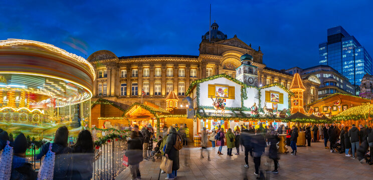 View of Christmas Market stalls in Victoria Square at dusk, Birmingham, West Midlands, England, United Kingdom