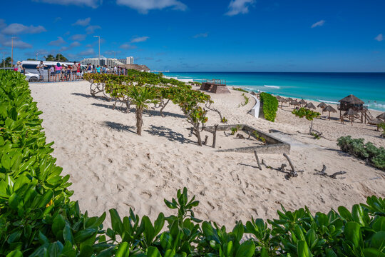 View of long white sandy beach at Playa Delfines, Hotel Zone, Cancun, Caribbean Coast, Yucatan Peninsula, Mexico
