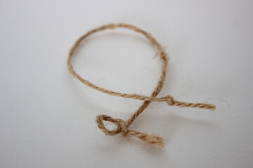 A twine trap in a white background