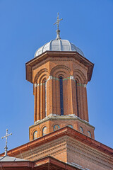 Holy Trinity Orthodox Church Tower at Prefecture Park Spring Day in Craiova Romania