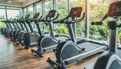 rows of stationary bike and health exercise equipment for bodybuilding in gym modern fitness center...