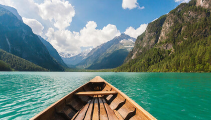 Wooden boat with paddles floating on turquoise water of calm lake on background of majestic landscape of highlands - obrazy, fototapety, plakaty