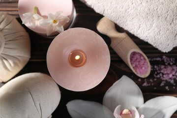 Composition with spa supplies and flowers on wooden table, flat lay