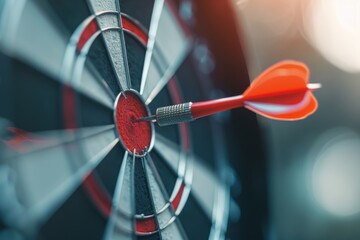 Close-up of a dart achieving bullseye on a classic dartboard, symbolizing precision and goal achievement. Bullseye on Dartboard in Close-up View
