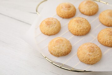 Tasty sweet sugar cookies on white wooden table, closeup. Space for text