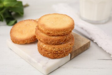 Fototapeta na wymiar Tasty sweet sugar cookies on white wooden table, closeup