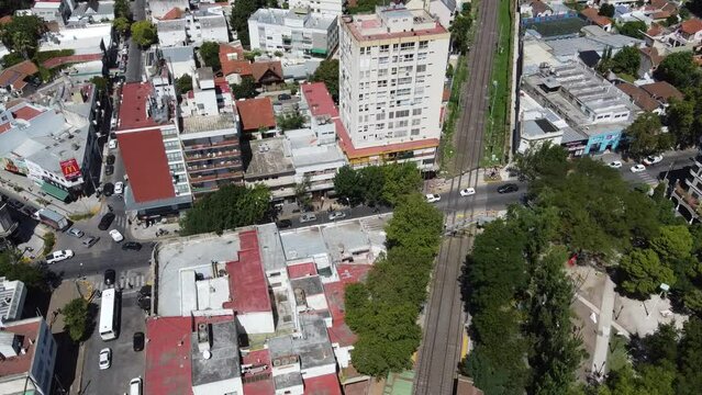 aerial view of the level crossing at the Adrogue railway and train station