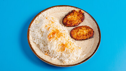 White rice and chicken cutlets in bowl
