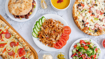 Food assortment. Portion doner kebab, lentil soup, pizza, pide, doner kebab top view