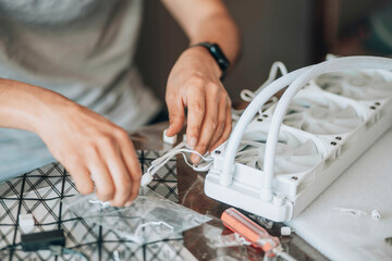 person engaged in assembling or working on computer hardware, likely involving precise technical...