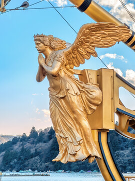 LAKE ASHI, HAKONE AREA, KANAGAWA PREFECTURE, JAPAN - MARCH 13, 2024: Golden figurehead on Queen Ashinoko, Lake Ashi pirate ship. 