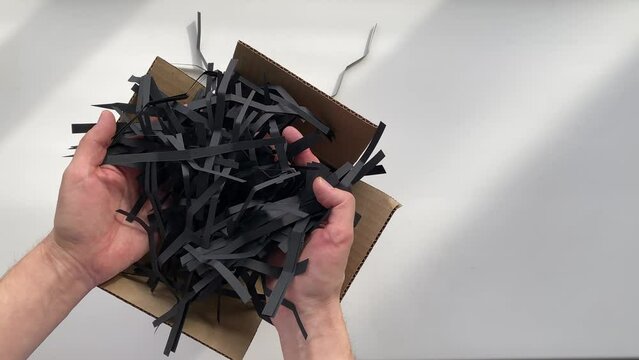 do it yourself. slow motion video. paper filler. black paper filler. 4K quality shooting