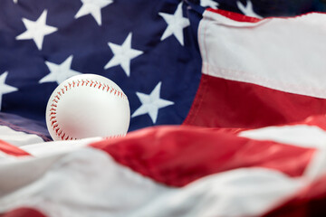 white baseball on the stars and stripes flag of the United States of America