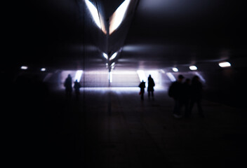 Underground passage in metro walking shadows of people