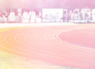 Empty jogging track on empty sunset stadium backdrop