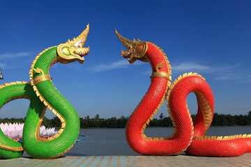 Naka in red and green decorate near the river and blue sky