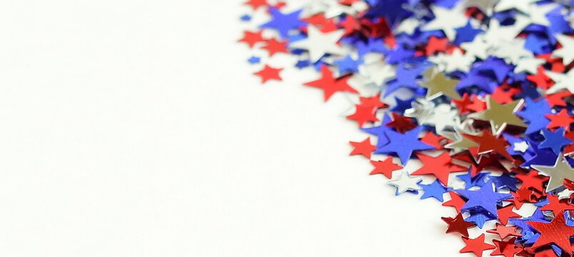 4th of July USA Independence Day confetti decorations american flag colors top view isolated on white background template mock up. Copy space. Banner. Celebration Memorial day in America.
