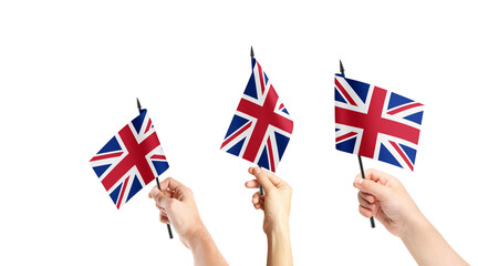 A group of people are holding small flags of United Kingdom in their hands. - obrazy, fototapety, plakaty