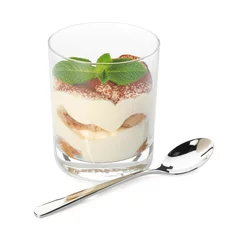  Delicious tiramisu in glass, mint leaves and spoon isolated on white © New Africa