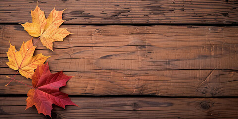 Flat lay with a fall maple leaves and copy space on a brown wooden background. AI generated