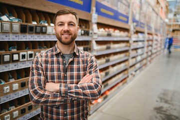 Young man working in hardware store