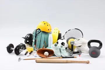 Deurstickers Many different sports equipment on light grey background © New Africa