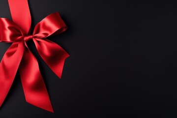 Blank for a Black Friday sales card. Black gift wrapped by red ribbon. Christmas, New Year or birthday gift.