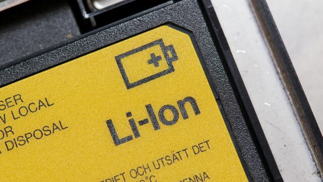 Generic Lithium Ion laptop battery, yellow Li-Ion cell for electronic devices object macro detail, extreme closeup, nobody. Lithium-Ion batteries simple icon symbol abstract concept, care, service