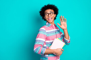 Photo of cheerful positive man student wear trendy clothes look empty space hello hi meeting...