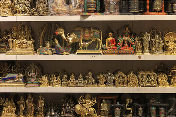 Hindi and buddhist god sculpture in souvenir shop. Tourism is the main economic sources in Nepal.