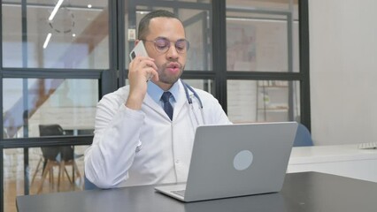 Hispanic Doctor Talking on phone in Clinic - Powered by Adobe