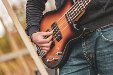 Man Playing Bass Guitar - obrazy, fototapety, plakaty