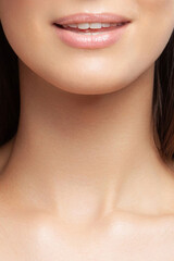 Lips, face oval and neck of young beautiful woman close-up