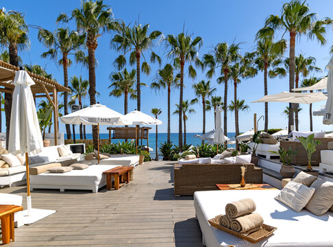 SPAIN, MARBELLA, 26, MAY, 2023: Nikki beach club with cozy summer furniture and a swimming pool on the Mediterranean coast in Elviria, Marbella. Spain.