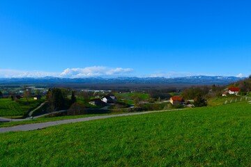 Village Oštrc bellow Gorjanci and hills in Dolenjska, Slovenia