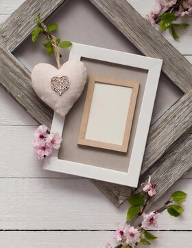 Spring invitation card mockup with heart ornament: rustic invitation card mockup adorned with a heart and blank photo frames, surrounded by spring blossoms