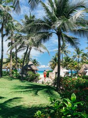 man walking towards the beach in the mexican caribbean