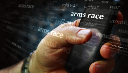 Arms race news titles on screen in hand 3d illustration