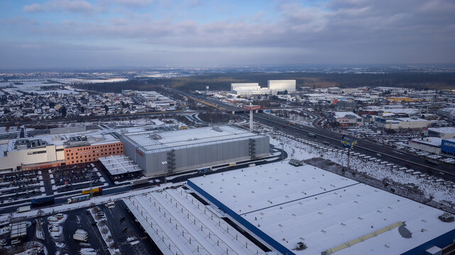 Weiterstadt, Germany January 19, 2024: View over the Weiterstadt commercial area with metro, Segmüller in winter with snow