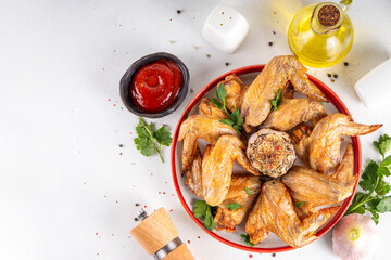 Grilled roasted spicy chicken wings with ketchup