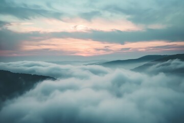 A sea of clouds blankets rolling hills at dawn, creating a surreal and ethereal vista.