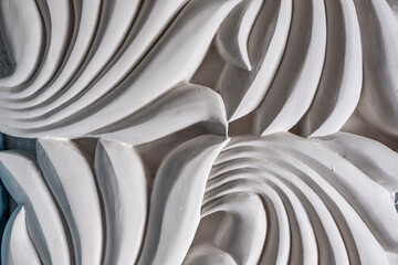 Wall panel design. White panel, realistic 3d embossed leaf design. Modern plaster stucco interior. Photo background.