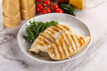 Grilled chicken breast served arugula
