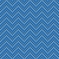 Blue knitted seamless tileable pattern. Knitted fabric texture. Realistic knit texture for wallpaper, background, wrapping paper.