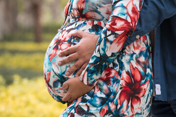 Big Pregnant belly child bearing motherhood - obrazy, fototapety, plakaty